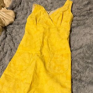 Vintage yellow Hawaiian flower dress. Front pockets